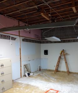 Demo of lunch room with ladder in photo