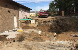 prepping for new foundation at back of existing building