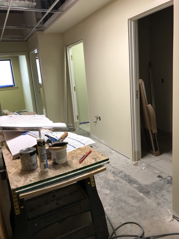 light paint color on walls and construction materials on saw horses